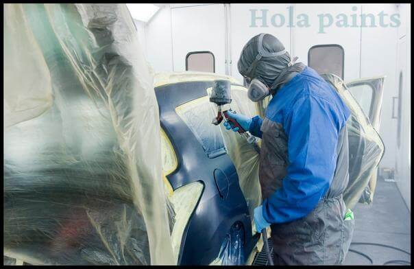 Beginner automotive painter using paint gun