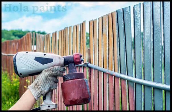 Staining a fence with sprayer