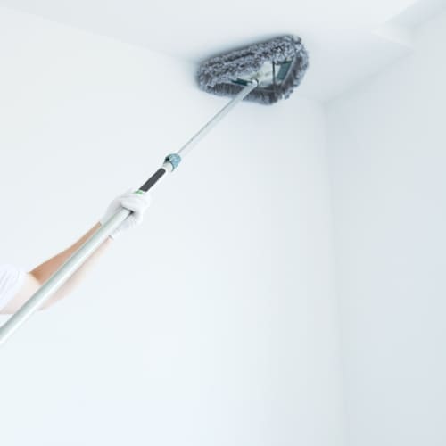 using triangle drywall cleaning tool